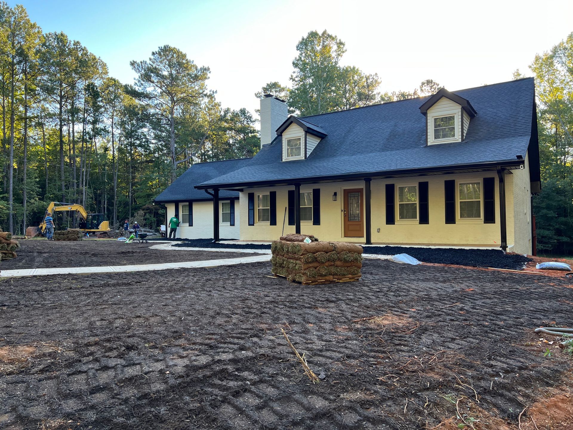 Sod staged on freshly graded ground